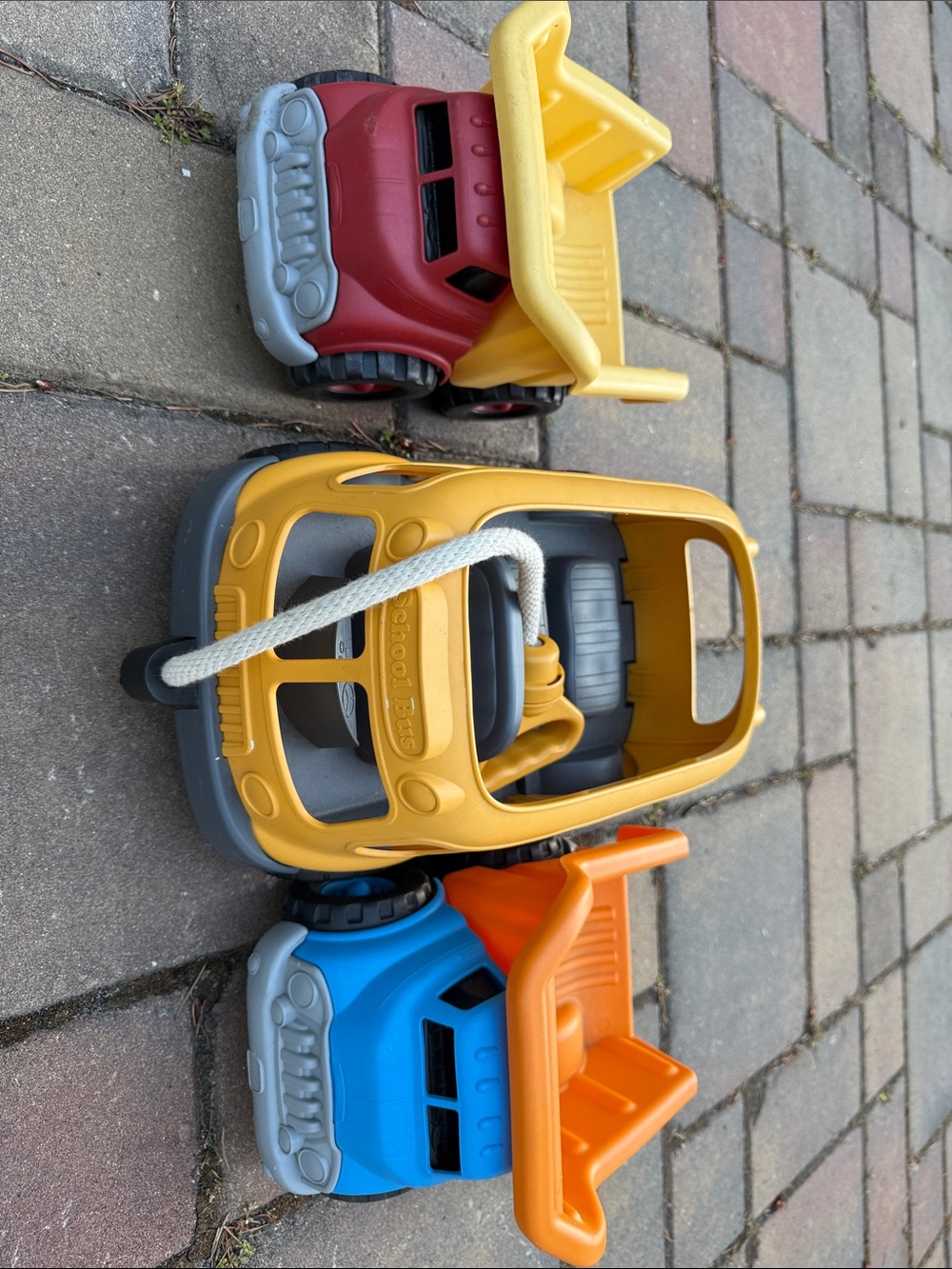 3 Green Toys ( bus and  2 dump trucks)